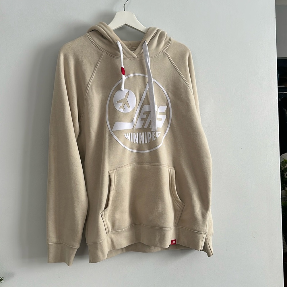 Beige Winnipeg jets hoodie.